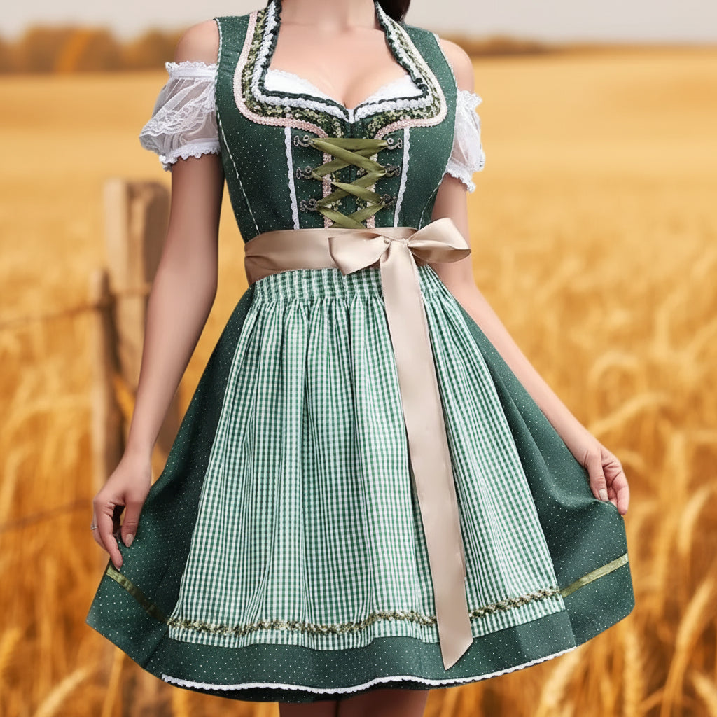 Person wearing a green and white traditional dress with a beige ribbon in a wheat field. Dirndl Midi Länge