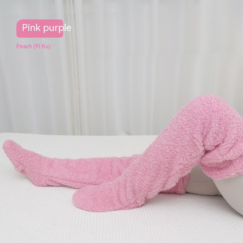 Pink fuzzy socks on a white surface with 'Pink purple' text.