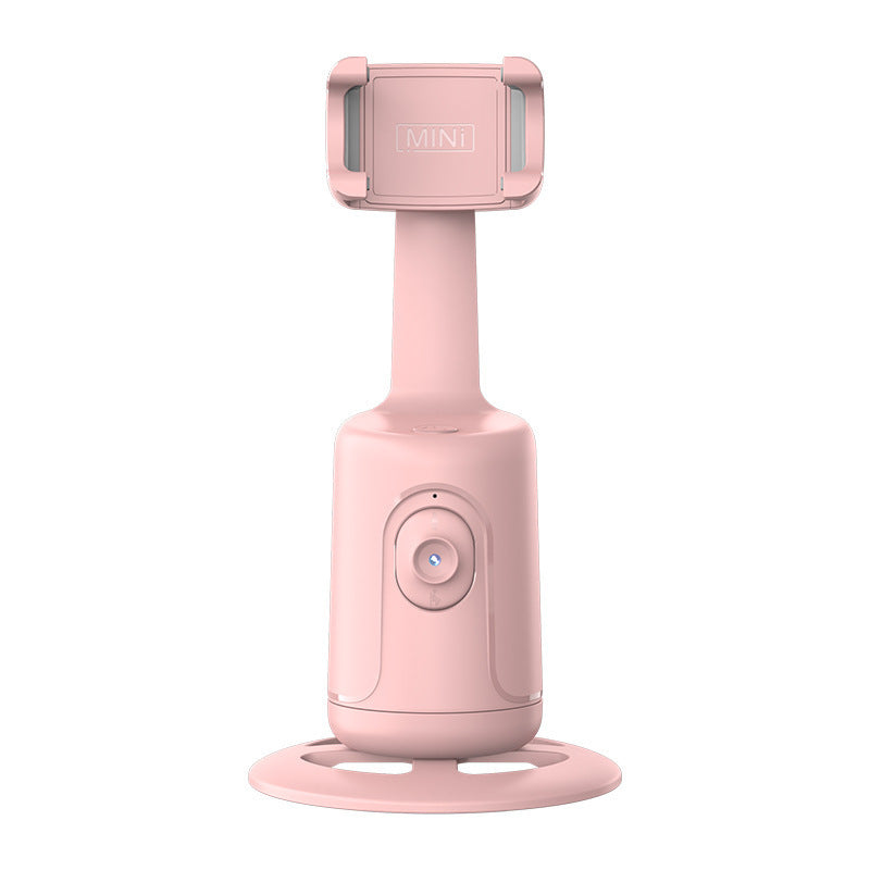 Pink handheld device with a stand on a white background ai tracking