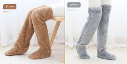 Two pairs of fuzzy knee-high socks, one brown and one light gray, on a white background.